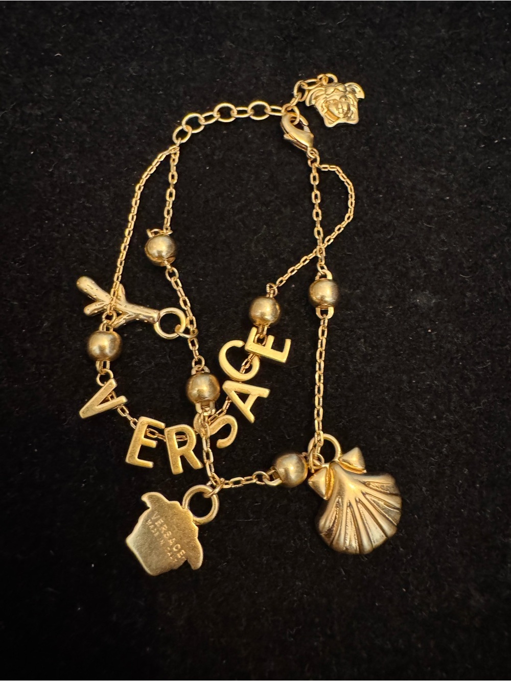 Versace Gold Letter and Shell Charm Bracelet